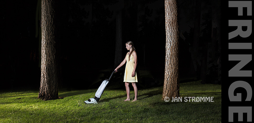 a young woman vacuuming the forest at night