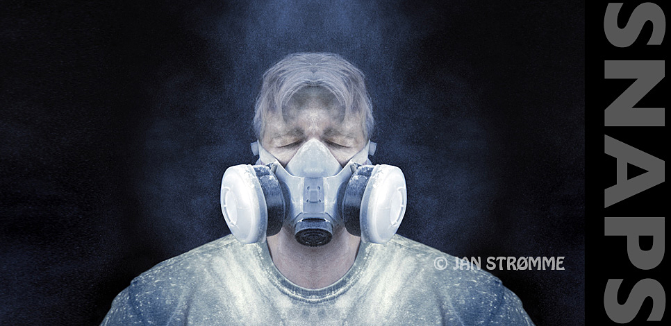 Surreal portrait of a construction worker wearing a protective mask in a dusty environment