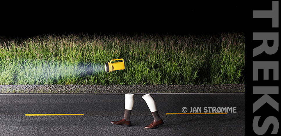 Pair of manikin legs walking on a road with flashlight