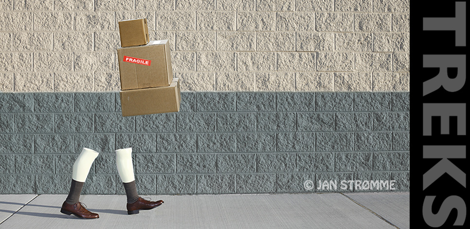 Surreal photograph of a pair of manikin legs and boxes